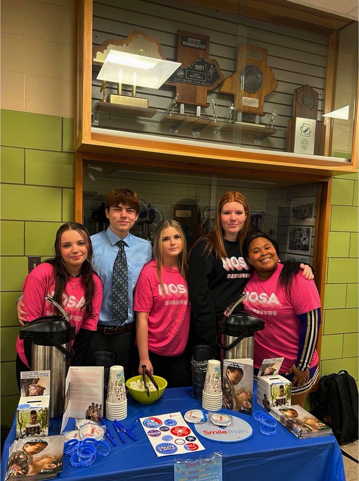 Bardstown HOSA students running a Smile Train fundraising table